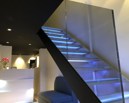 Glass stair in showroom Insensation in New York