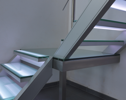 Illuminated stair with glass treads at Devloo in Eeklo