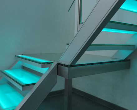 Illuminated stair with glass treads at Devloo in Eeklo