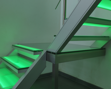 Illuminated stair with glass treads at Devloo in Eeklo