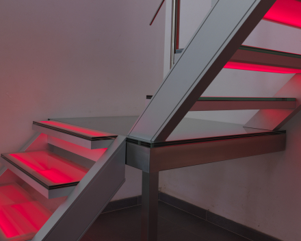 Illuminated stair with glass treads at Devloo in Eeklo