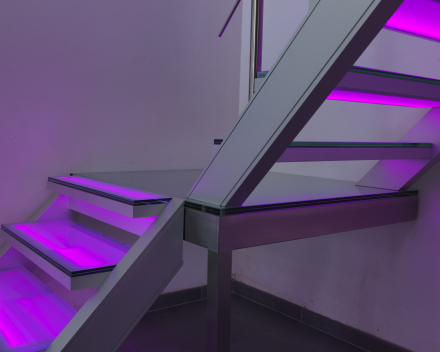 Illuminated stair with glass treads at Devloo in Eeklo