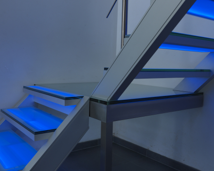 Illuminated stair with glass treads at Devloo in Eeklo